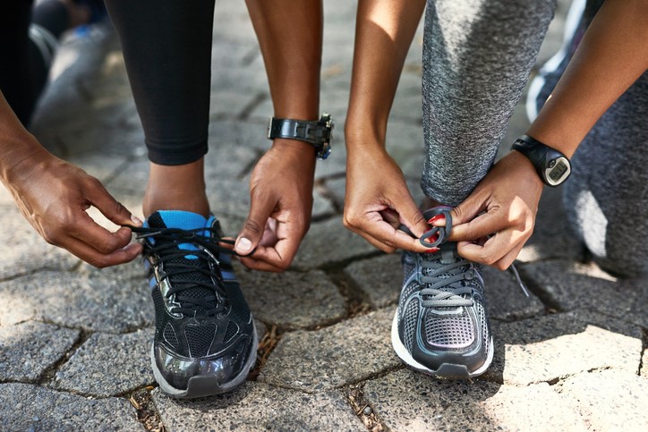 couple tying shoes