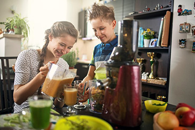 People making a smoothie together
